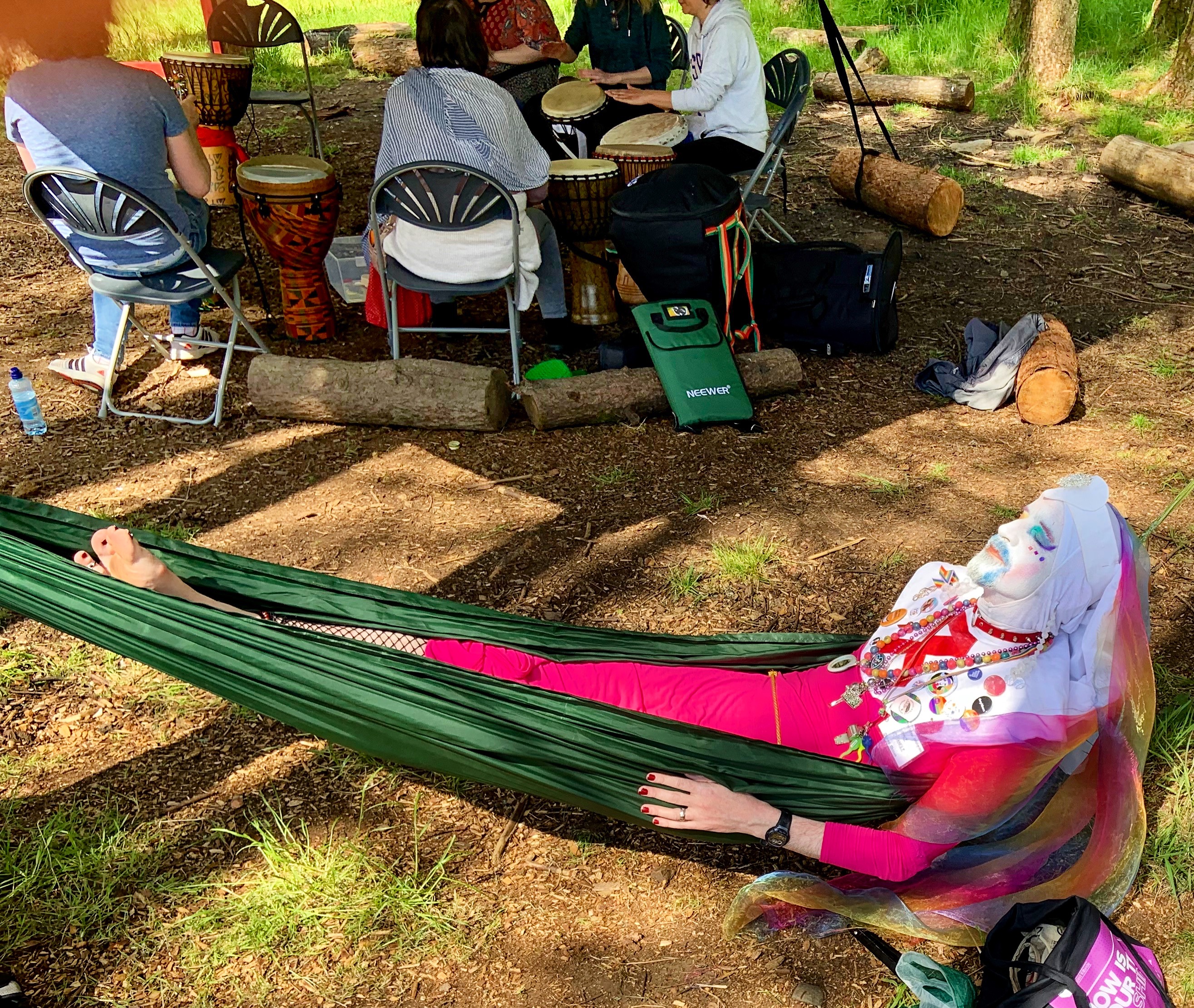 Novice Wye Dangle of the Glasgow Mission of the Order of Perpetual Indulgence relaxes in a hammock at the end of K-Pride 2019